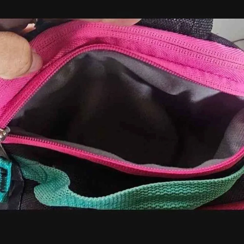 AVIA Black, Blue and Pink Backpack with Multi pockets. New without Tags